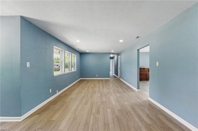 725 Burgesses Ln, Virginia Beach, VA 23452 - empty room featuring baseboards, a textured ceiling, light wood-style flooring, and visible vents
