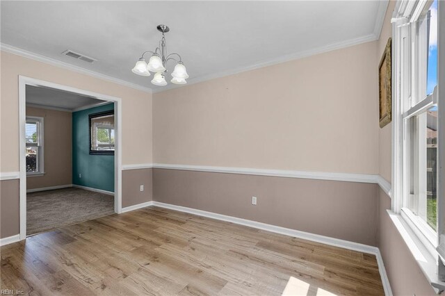 1101 Revelstroke Ct, Virginia Beach, VA 23454 - empty room featuring a chandelier, wood finished floors, ornamental molding, and baseboards