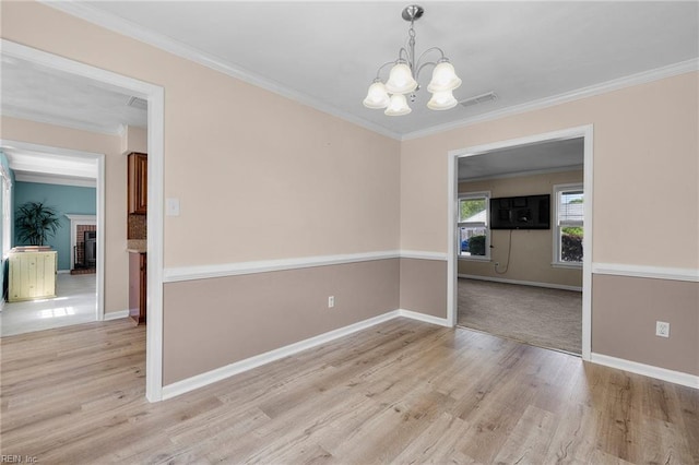 1101 Revelstroke Ct, Virginia Beach, VA 23454 - spare room featuring a chandelier, light wood finished floors, baseboards, and ornamental molding