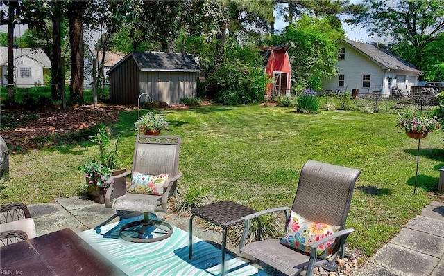 view of yard featuring a fenced backyard, an outdoor structure, a patio area, and a shed