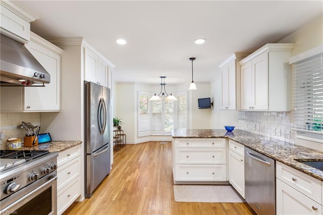 200 Moodys Run, Williamsburg, VA 23185 - kitchen featuring stainless steel appliances, white cabinets, a peninsula, recessed lighting, and tasteful backsplash