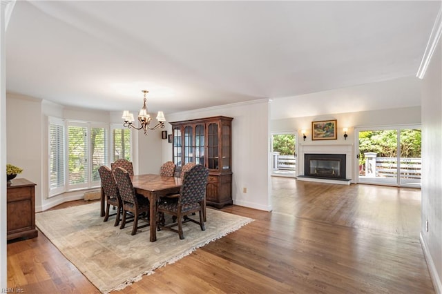 200 Moodys Run, Williamsburg, VA 23185 - dining space with a chandelier, crown molding, healthy amount of natural light, wood finished floors, and baseboards