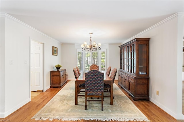 200 Moodys Run, Williamsburg, VA 23185 - dining room featuring a chandelier, light wood finished floors, baseboards, and ornamental molding