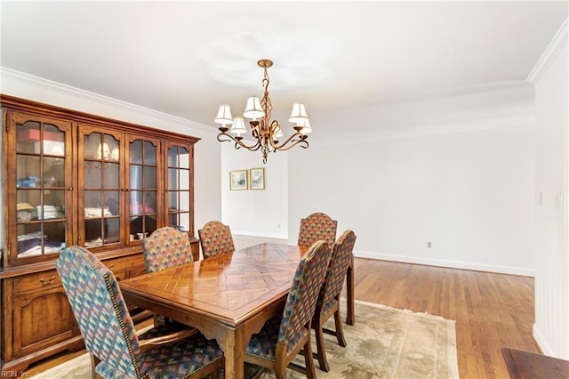 200 Moodys Run, Williamsburg, VA 23185 - dining space with a chandelier, crown molding, light wood-style flooring, and baseboards