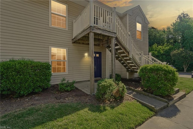 doorway to property with a yard