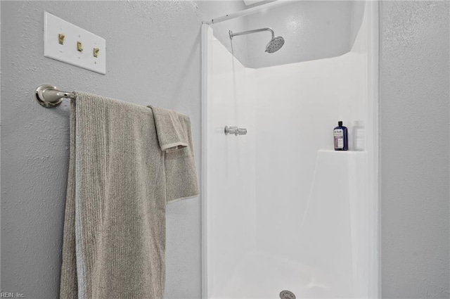 full bathroom with a stall shower
