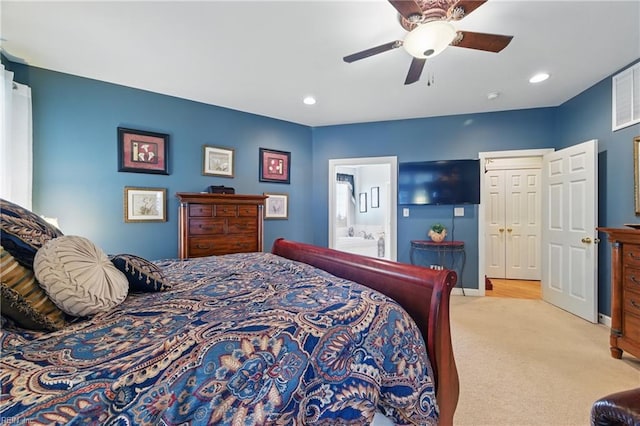 bedroom with connected bathroom, a ceiling fan, light colored carpet, and recessed lighting