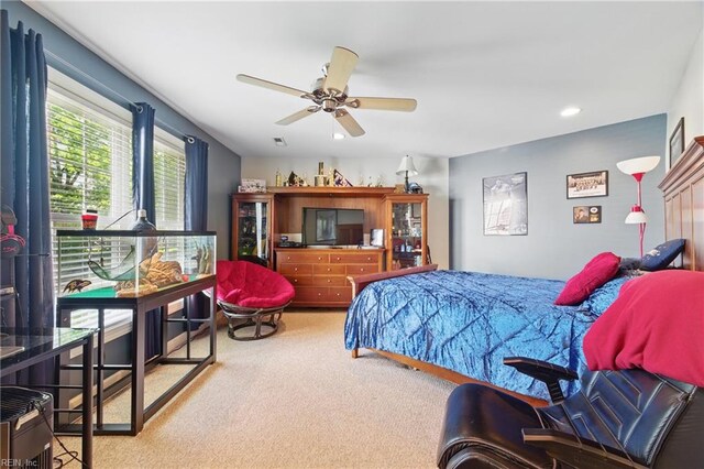 bedroom with carpet floors, recessed lighting, ceiling fan, and visible vents