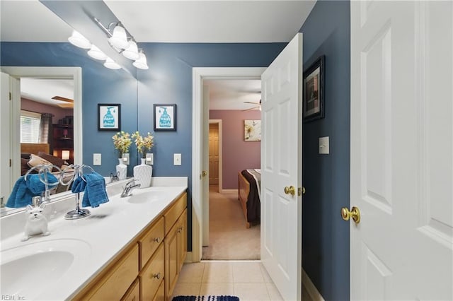 bathroom featuring double vanity, a sink, ensuite bath, and tile patterned floors