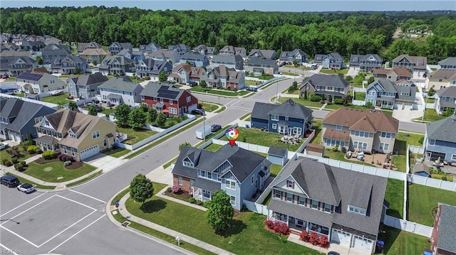 aerial view with a residential view and a wooded view