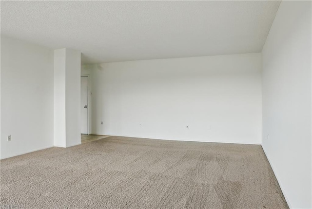2830 Shore Dr Unit 900, Virginia Beach, VA 23451 - carpeted empty room with a textured ceiling