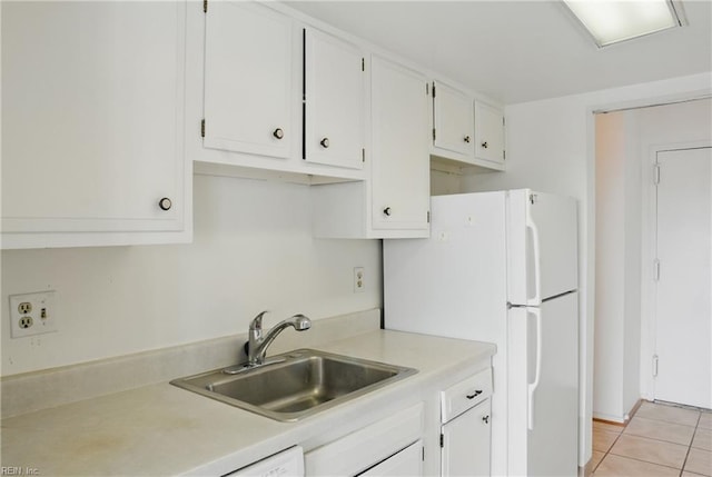 2830 Shore Dr Unit 900, Virginia Beach, VA 23451 - kitchen with light countertops, light tile patterned flooring, white cabinets, and a sink