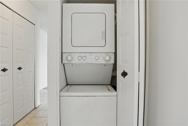 2830 Shore Dr Unit 900, Virginia Beach, VA 23451 - washroom with laundry area, light tile patterned floors, and stacked washer / drying machine