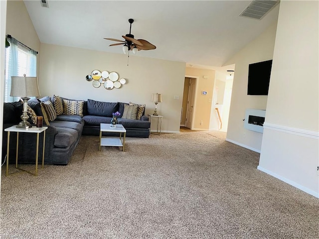 living room featuring carpet floors, a ceiling fan, vaulted ceiling, and visible vents