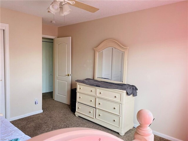carpeted bedroom with baseboards and a ceiling fan