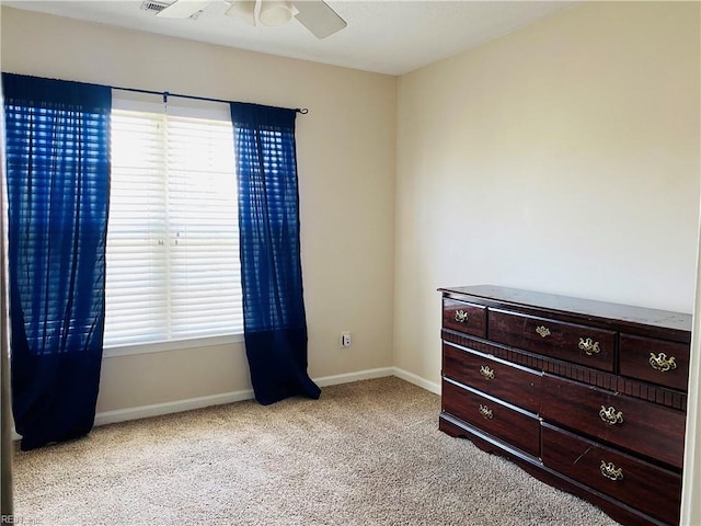 bedroom featuring carpet floors, baseboards, and ceiling fan