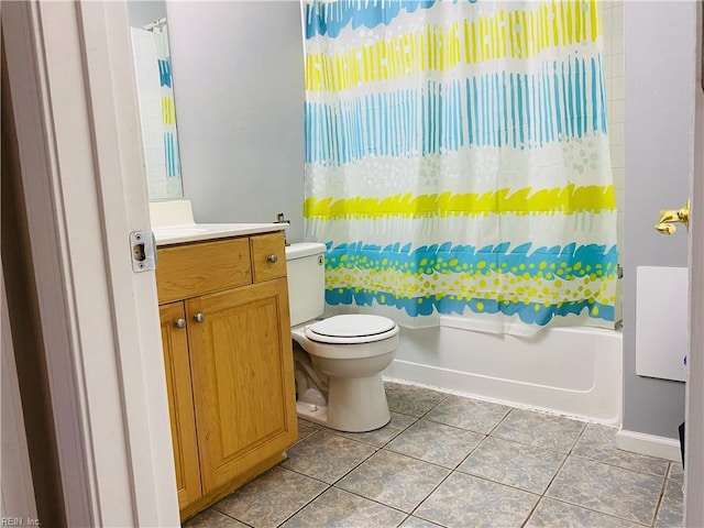 bathroom with tile patterned floors, vanity, toilet, and shower / tub combo with curtain