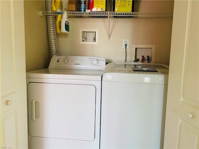 washroom with laundry area and washing machine and dryer