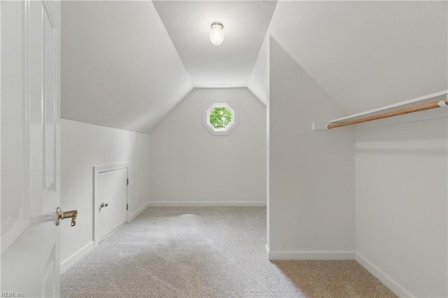 bonus room featuring baseboards, lofted ceiling, and carpet