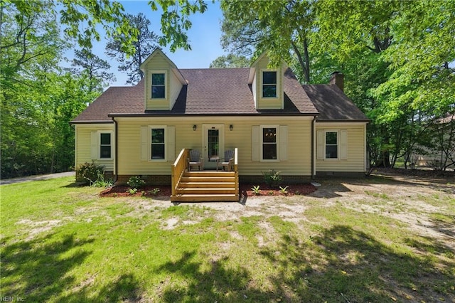 view of front of home with crawl space, a chimney, a shingled roof, and a front yard