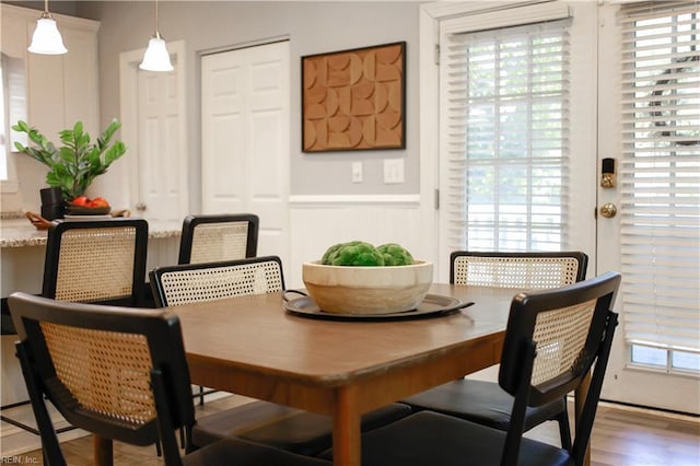 dining space featuring wood finished floors