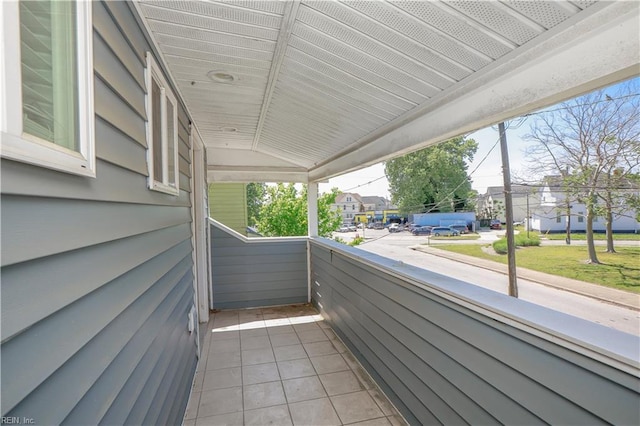 view of patio / terrace with a residential view and a balcony