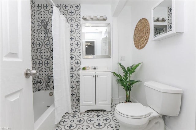 full bath with vanity, tile patterned floors, toilet, and shower / tub combo