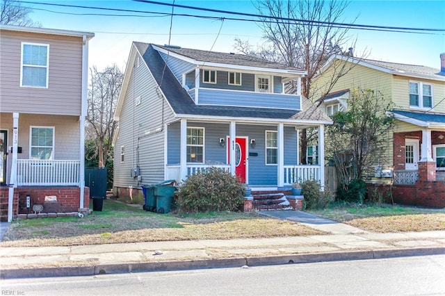 view of front of home with a porch and roof with shingles