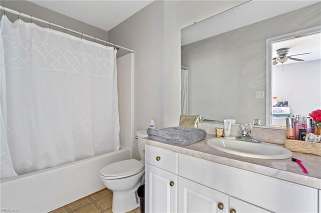 bathroom with vanity, ceiling fan, shower / bath combo, and toilet