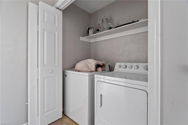 clothes washing area featuring laundry area and independent washer and dryer