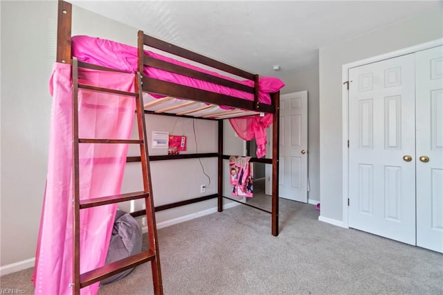 unfurnished bedroom featuring carpet floors and baseboards