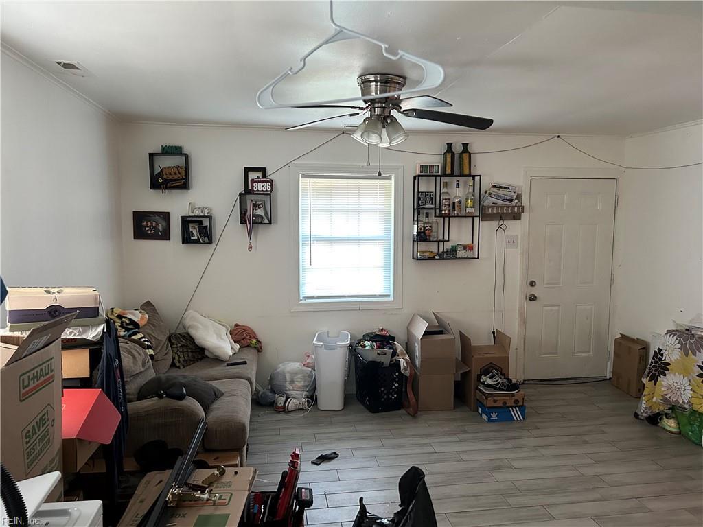 dining area featuring crown molding, ceiling fan, and wood finished floors