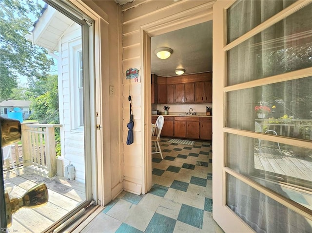 interior space featuring a sink and light floors