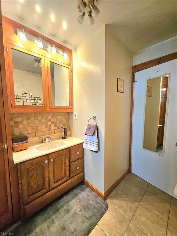 215 N 6th St, Hampton, VA 23664 - bathroom featuring tile patterned flooring, baseboards, vanity, and tasteful backsplash