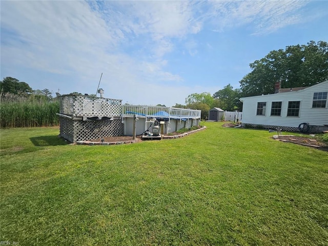 view of yard with a storage shed, an outdoor structure, and a covered pool