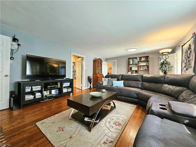 living area featuring dark wood-style floors