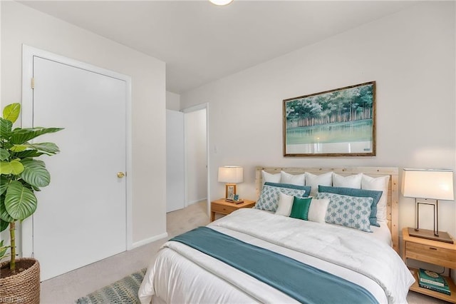 carpeted bedroom with baseboards