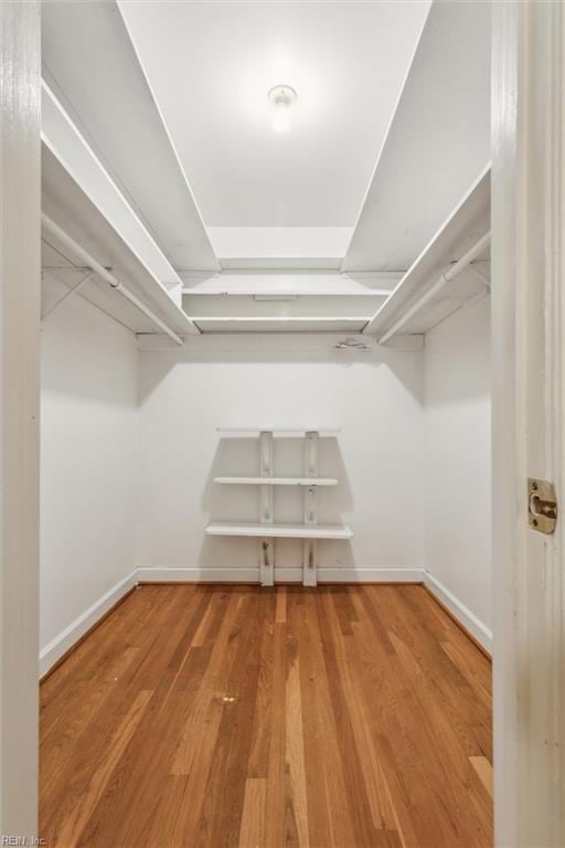 spacious closet with wood finished floors