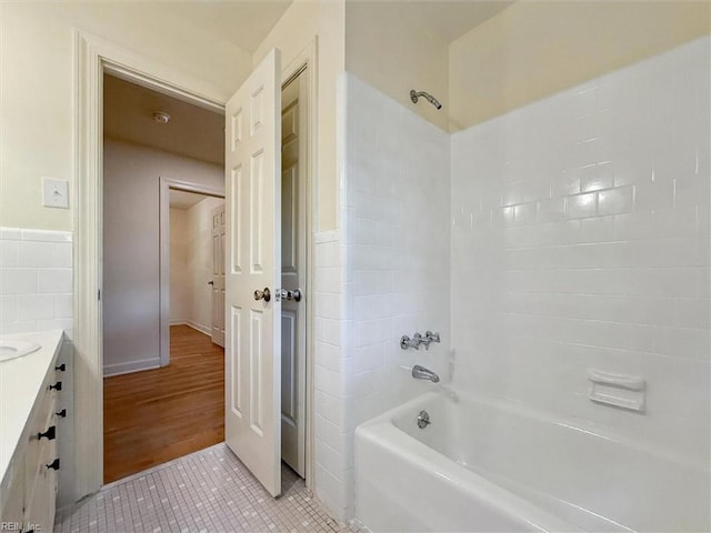 bathroom with vanity, washtub / shower combination, and tile patterned flooring