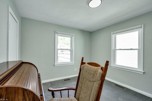 interior space featuring baseboards and visible vents