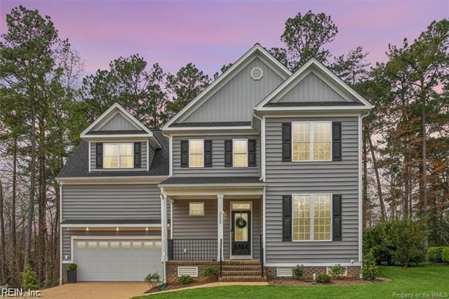 3009 Ridge Dr, Toano, VA 23168 - craftsman inspired home with a front lawn, a garage, board and batten siding, concrete driveway, and covered porch