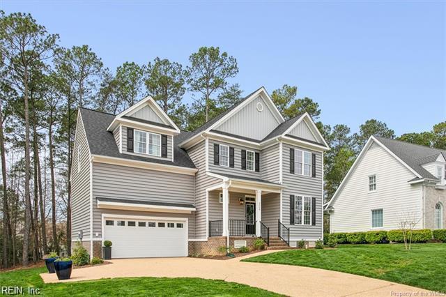 3009 Ridge Dr, Toano, VA 23168 - craftsman-style home featuring a front lawn, covered porch, board and batten siding, an attached garage, and driveway