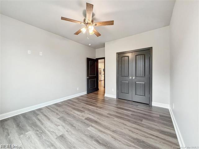 3009 Ridge Dr, Toano, VA 23168 - unfurnished bedroom featuring baseboards, ceiling fan, a closet, and wood finished floors