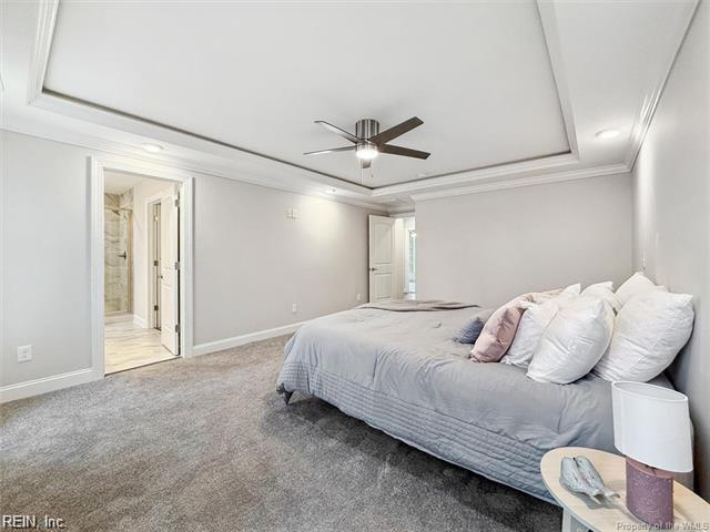 3009 Ridge Dr, Toano, VA 23168 - carpeted bedroom with crown molding, recessed lighting, a tray ceiling, and baseboards