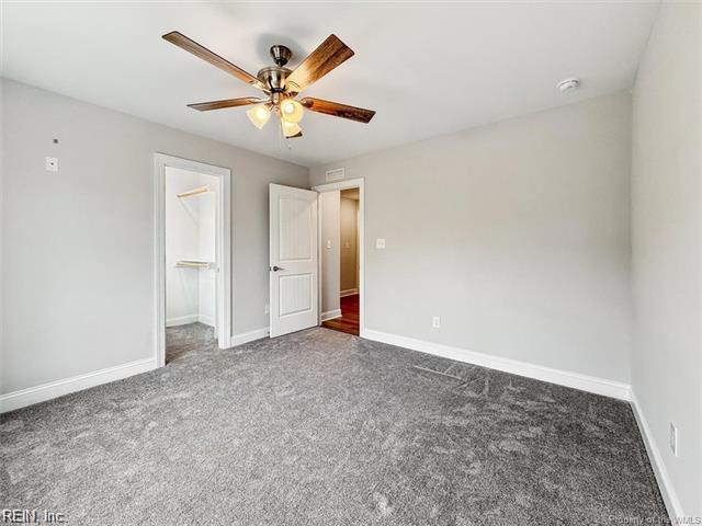 3009 Ridge Dr, Toano, VA 23168 - unfurnished bedroom featuring baseboards, carpet, and a ceiling fan