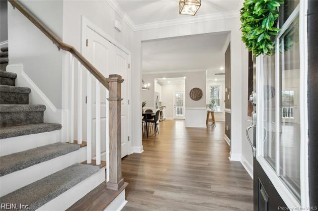 3009 Ridge Dr, Toano, VA 23168 - foyer with ornamental molding, stairs, and wood finished floors