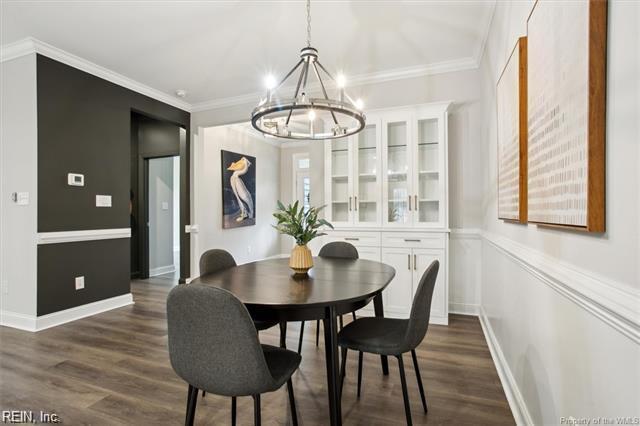 3009 Ridge Dr, Toano, VA 23168 - dining space with baseboards, crown molding, a chandelier, and dark wood-style floors