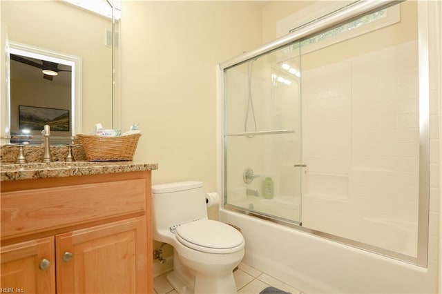 full bathroom featuring tile patterned flooring, visible vents, vanity, shower / bath combination with glass door, and toilet