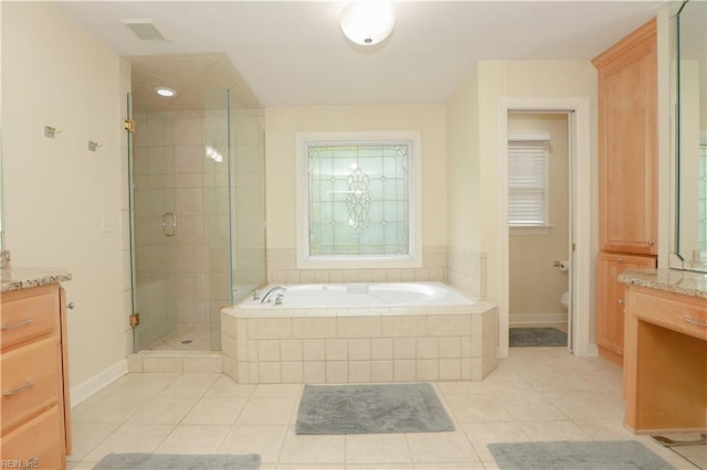 bathroom featuring tile patterned flooring, a garden tub, visible vents, vanity, and a stall shower