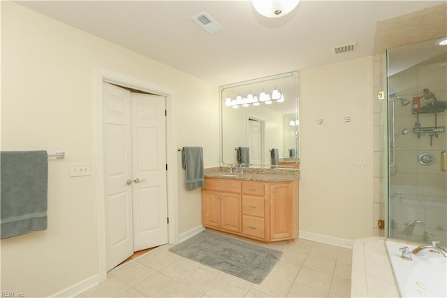bathroom with visible vents, tile patterned floors, and a shower stall